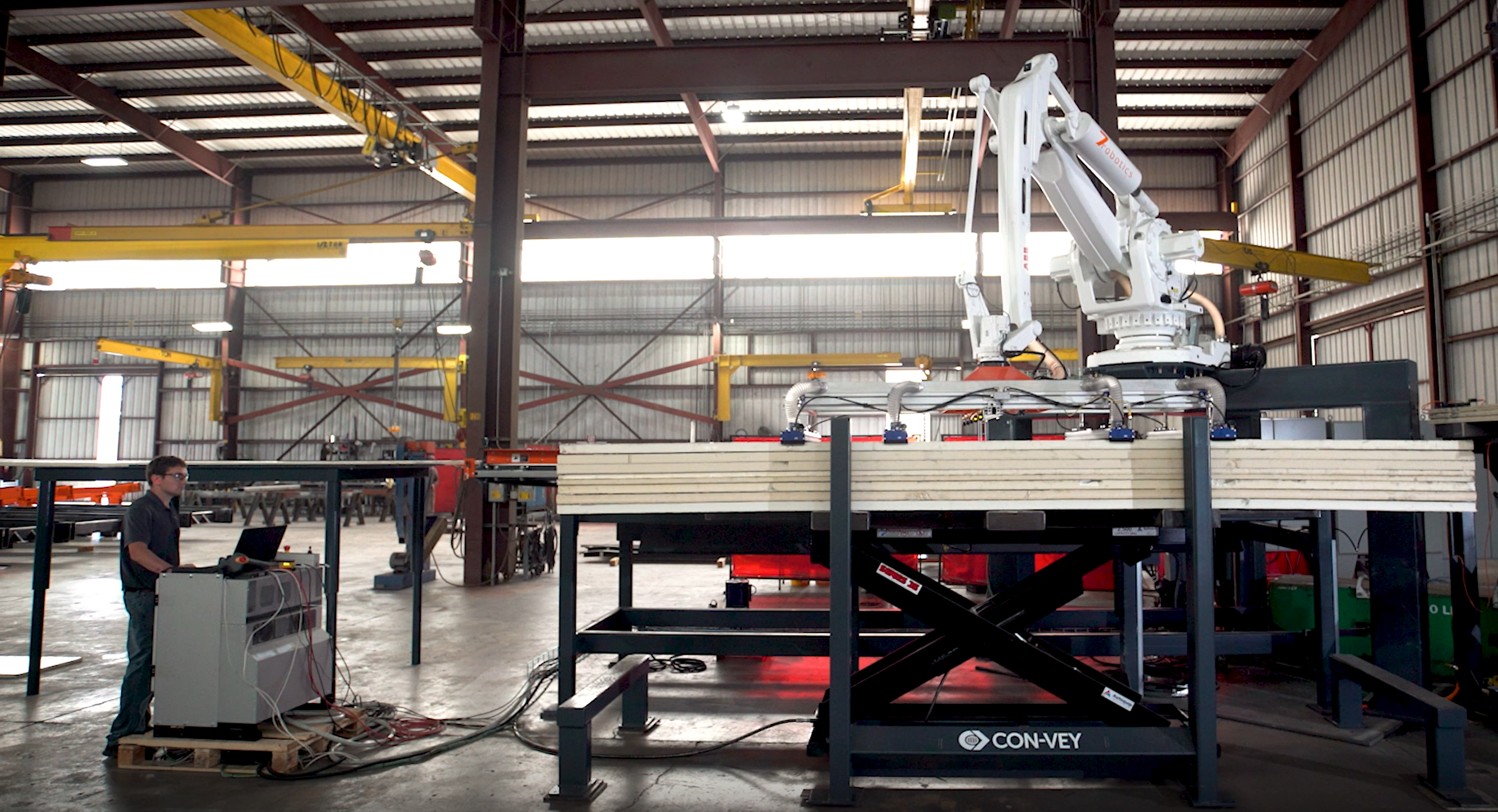 Heavy-Duty Scissor Lift Integrates with Robotic Stacking Line - Autoquip