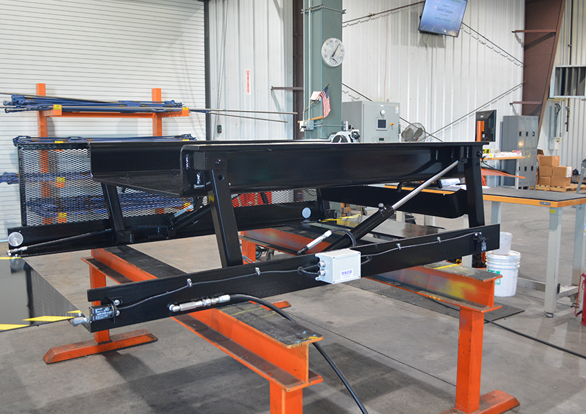 Articulating Bullet Lift for New AGV Application - Autoquip Lifting Solutions