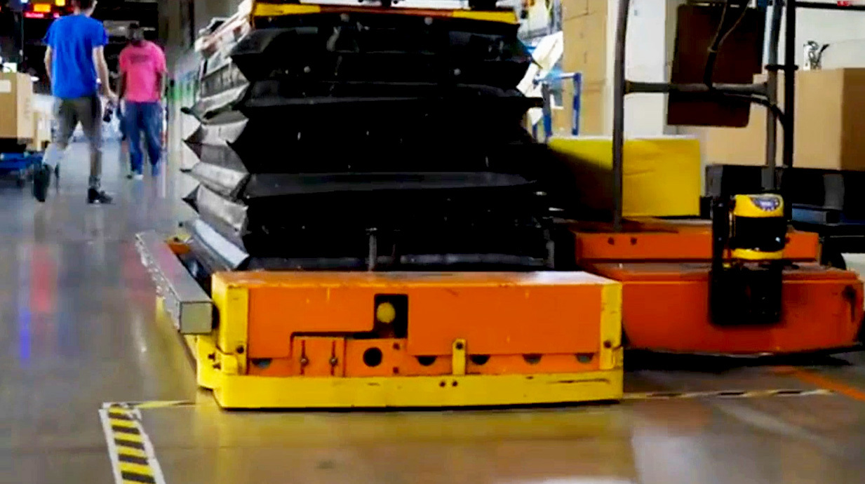 Lift system integration connects conveyors, robotics, and AGVs to eliminate bottlenecks