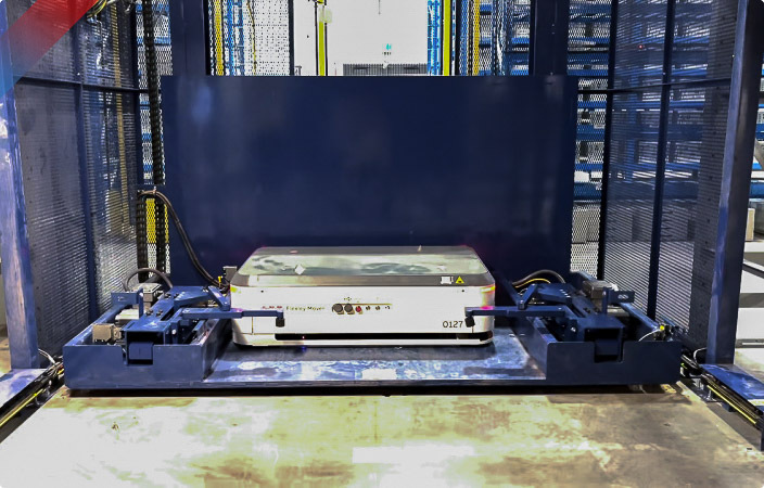 AGV pallet shuttle operating within an automated warehouse storage and retrieval system